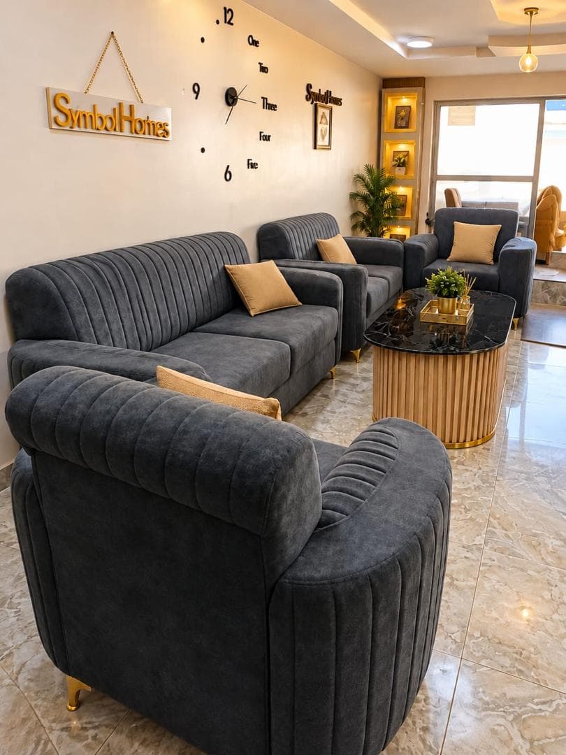 Charcoal four-piece sofa set arranged in the showroom